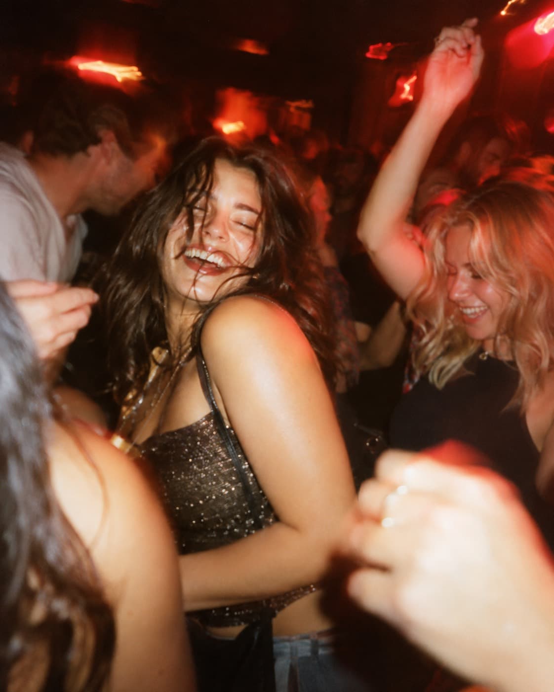 Friends dancing together in the club