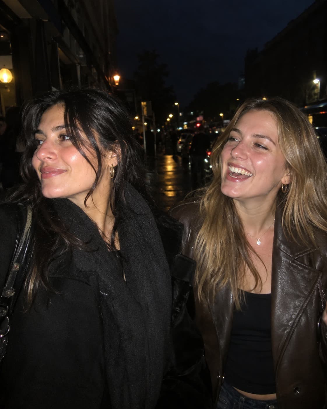 Two friends laughing outside the venue